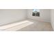 Bright bedroom featuring neutral carpet and a window offering natural light at 3218 N Lafayette Dr, Florence, AZ 85132