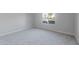 Bedroom with neutral carpet, natural light, and a view of the neighborhood at 3218 N Lafayette Dr, Florence, AZ 85132