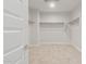 Walk-in closet features neutral carpet and shelving providing ample storage at 3218 N Lafayette Dr, Florence, AZ 85132