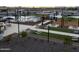 A view of the Community Center's lawn area with seating, cornhole, and playground at 3353 E Alexander Dr, San Tan Valley, AZ 85143