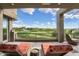 Spacious balcony overlooking a lush golf course on a sunny day, complete with comfortable seating at 37200 N Cave Creek Rd # 2127, Scottsdale, AZ 85262