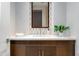 Stylish powder room featuring elegant fixtures, modern decor, and a decorative mirror at 37200 N Cave Creek Rd # 2127, Scottsdale, AZ 85262