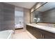 Stylish bathroom showcasing double sink vanity and seamless flow to bedroom at 37200 N Cave Creek Rd # 2127, Scottsdale, AZ 85262
