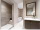 Bright bathroom offering walk-in shower, soaking tub, and modern vanity at 37200 N Cave Creek Rd # 2127, Scottsdale, AZ 85262