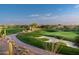 Beautifully landscaped golf course with a winding path and a backdrop of desert scenery and mountains at 37200 N Cave Creek Rd # 2127, Scottsdale, AZ 85262