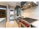 Stylish kitchen with stainless steel appliances, a range, custom cabinets, and an open layout at 37200 N Cave Creek Rd # 2127, Scottsdale, AZ 85262