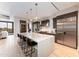 Modern kitchen with a large island, counter seating, stainless steel appliances, and a view at 37200 N Cave Creek Rd # 2127, Scottsdale, AZ 85262