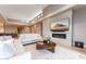 Comfortable living room with a fireplace, TV, and modern decor at 37200 N Cave Creek Rd # 2127, Scottsdale, AZ 85262
