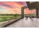An outdoor patio featuring ample seating and stunning desert and golf course views from this well appointed home at 37200 N Cave Creek Rd # 2127, Scottsdale, AZ 85262