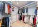Organized walk-in closet featuring custom shelving and ample storage space at 37200 N Cave Creek Rd # 2127, Scottsdale, AZ 85262