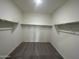 Large walk-in closet with double hanging rods and shelving at 38141 N Stallion St, San Tan Valley, AZ 85140