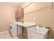 Laundry room with washer, dryer, cabinets, and utility sink at 3840 S Nebraska St, Chandler, AZ 85248