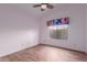 Bedroom with laminate floors, ceiling fan and natural lighting at 532 S Lagoon Dr, Gilbert, AZ 85233