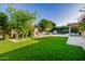 Artificial turf lawn, walkways, and outdoor kitchen at 5430 E Calle Redonda --, Phoenix, AZ 85018