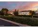 Brick house with a landscaped yard at dusk at 5430 E Calle Redonda --, Phoenix, AZ 85018