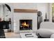 Modern fireplace with white brick surround and wood mantel at 5430 E Calle Redonda --, Phoenix, AZ 85018