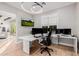 Modern home office featuring a large desk and multiple monitors at 5430 E Calle Redonda --, Phoenix, AZ 85018