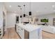 White kitchen with large island, stainless steel appliances, and blue lighting at 5430 E Calle Redonda --, Phoenix, AZ 85018