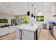 Bright kitchen, features island, stainless steel appliances, and opens to Gathering room at 5430 E Calle Redonda --, Phoenix, AZ 85018