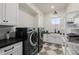 Bright laundry room with washer, dryer, and ample storage at 5430 E Calle Redonda --, Phoenix, AZ 85018