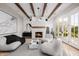 Bright living room features a fireplace, large windows, and comfy seating at 5430 E Calle Redonda --, Phoenix, AZ 85018