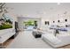 Open living space with white sectional sofa and view of backyard at 5430 E Calle Redonda --, Phoenix, AZ 85018