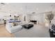 Open concept living room with white sectional and kitchen views at 5430 E Calle Redonda --, Phoenix, AZ 85018