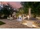 Stunning outdoor kitchen with brick oven, grill, and bar seating at 5430 E Calle Redonda --, Phoenix, AZ 85018