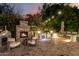 Brick fireplace and outdoor kitchen at night at 5430 E Calle Redonda --, Phoenix, AZ 85018