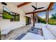 Outdoor patio features a sectional sofa and TV at 5430 E Calle Redonda --, Phoenix, AZ 85018