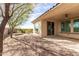 Landscaped backyard with patio and fire pit at 5575 W Cinder Brook Way, Florence, AZ 85132