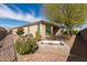 View of home's exterior and backyard at 5575 W Cinder Brook Way, Florence, AZ 85132