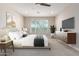 Spacious bedroom with large window and stylish dresser at 5575 W Cinder Brook Way, Florence, AZ 85132