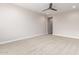 Light and airy bedroom with neutral decor and ceiling fan at 5575 W Cinder Brook Way, Florence, AZ 85132