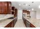 Modern kitchen with granite countertops and stainless steel appliances at 5575 W Cinder Brook Way, Florence, AZ 85132