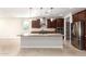 Modern kitchen with granite countertops, stainless steel appliances, and an island at 5575 W Cinder Brook Way, Florence, AZ 85132