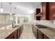 Kitchen with granite countertops and stainless steel appliances at 5575 W Cinder Brook Way, Florence, AZ 85132