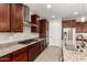 Kitchen with stainless steel appliances and granite countertops at 5575 W Cinder Brook Way, Florence, AZ 85132