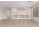 Living room featuring built-in shelving and tile flooring at 5575 W Cinder Brook Way, Florence, AZ 85132