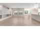 Open living room with kitchen views and tile floors at 5575 W Cinder Brook Way, Florence, AZ 85132