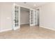 Bright office with French doors and tile flooring at 5575 W Cinder Brook Way, Florence, AZ 85132