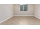 Simple office space with tile flooring and a window at 5575 W Cinder Brook Way, Florence, AZ 85132