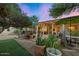 Inviting backyard oasis with patio, string lights, and plants at 6206 E Avalon Dr, Scottsdale, AZ 85251