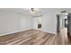 Bedroom with wood-like floors and barn door leading to en-suite bathroom at 6314 E Pinchot Ave, Scottsdale, AZ 85251