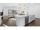 Modern kitchen island with white cabinets and a farmhouse sink at 641 E Greenback Dr, San Tan Valley, AZ 85140