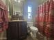 Clean bathroom with a shower/tub combo and patterned shower curtain at 650 N Hawes Rd # 2713, Mesa, AZ 85207