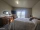 Main bedroom with a queen-size bed, dresser, and large windows at 650 N Hawes Rd # 2713, Mesa, AZ 85207