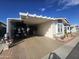 Covered carport with space for a golf cart and more at 650 N Hawes Rd # 2713, Mesa, AZ 85207