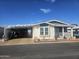 Cute manufactured home with carport and landscaped yard at 650 N Hawes Rd # 2713, Mesa, AZ 85207