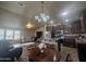 Open concept kitchen and living area with granite counters and stainless steel appliances at 650 N Hawes Rd # 2713, Mesa, AZ 85207